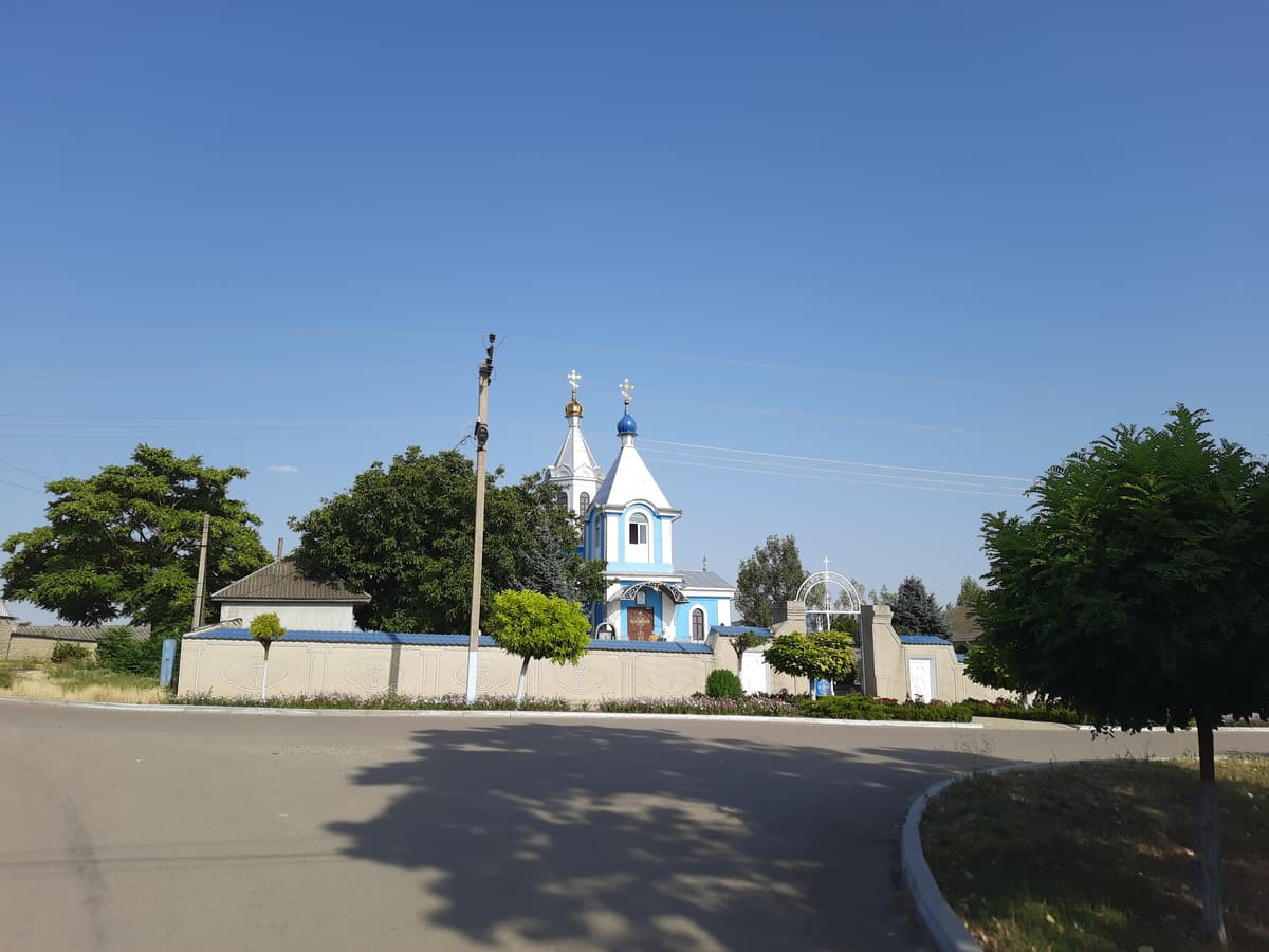The Church of the Archangel Michael in Avdarma seen across the village square